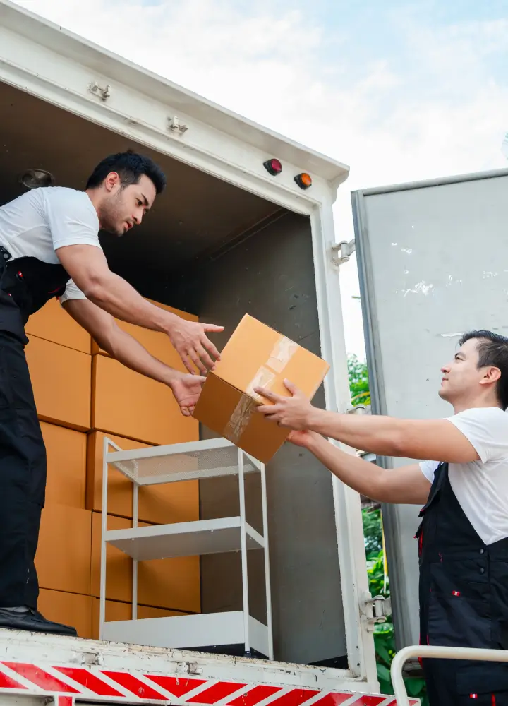 Moving service workers handling boxes
